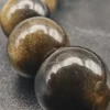 Details perles obsdienne doree