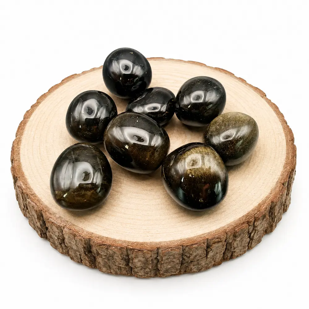 pierres roulées obsidienne dorée sur rondin de bois par romain creation