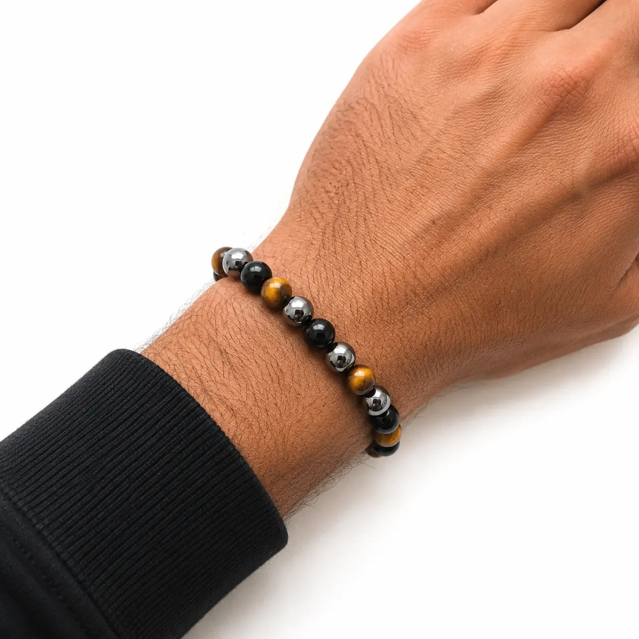 Bracelet hematite - oeil de tigre - obsidienne noire sur poignet homme